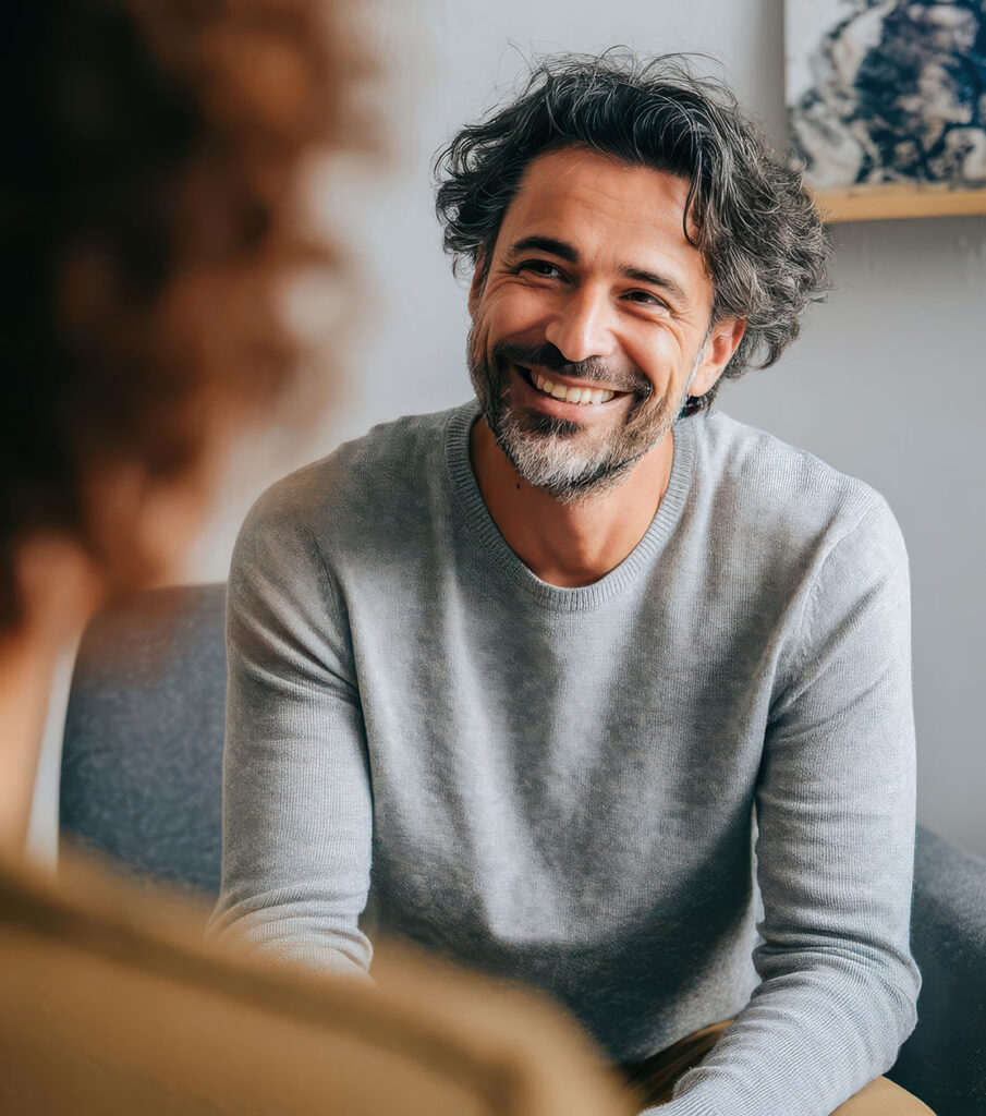 Psychiatric nurse practitioner listening attentively to a patient during an ADHD evaluation